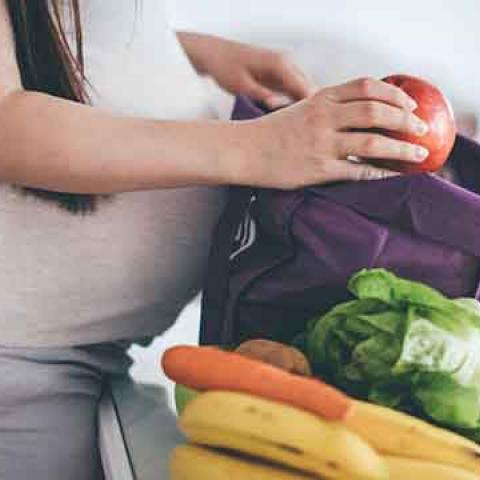 pregnant woman with groceries