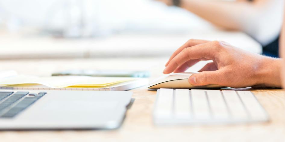 A person using a mouse and keyboard.