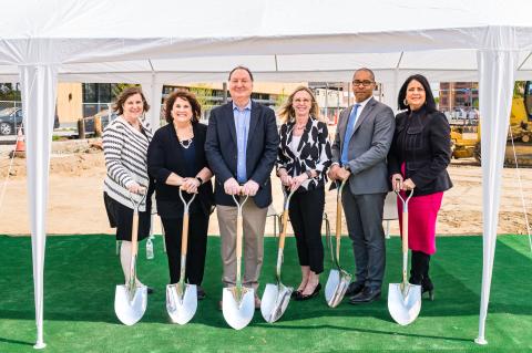 People holding shovels at a groundbreaking 