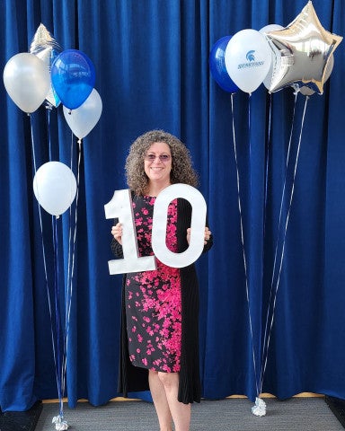 Jessica DeCaro holding 10 sign