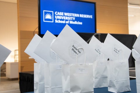 Table with bags full of envelopes