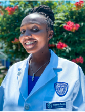 Rebekah Russell standing outside with white coat