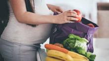 pregnant woman with groceries