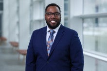 smiling man in blue suit 