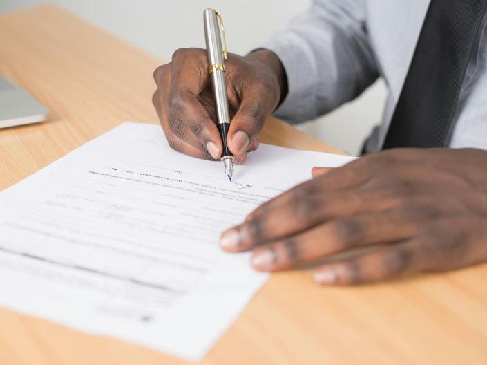Person writing a report