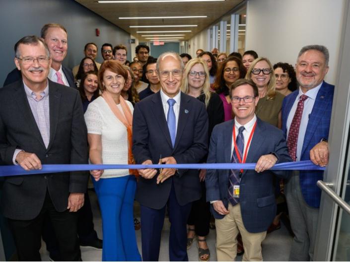 Dean Gerson leads the ribbon cutting for the Robbins 4th Floor grand opening.