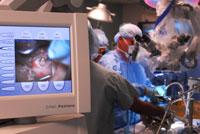 Doctors in surgery showing the monitor