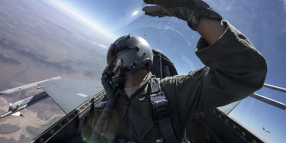 Pilot turning to view his six