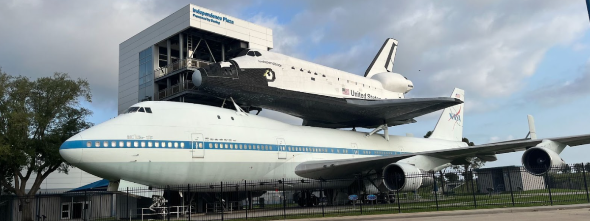 Space shuttle on top of transporter plane 