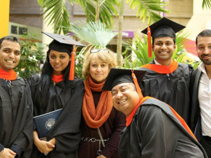 CWRU MEM grads posing for a group shot after graduation