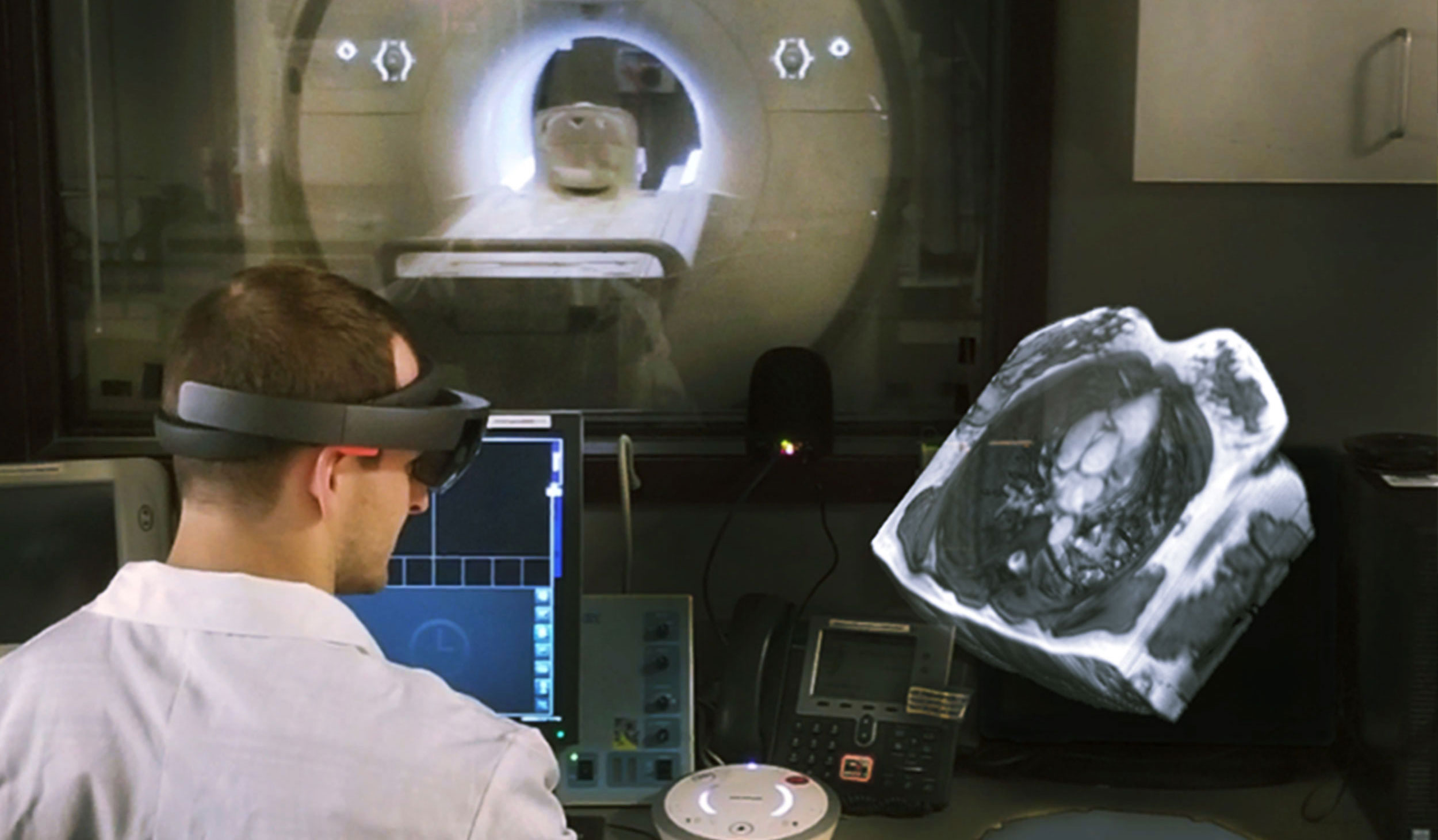 man wearing hololens and looking at 3D scan from an MRI