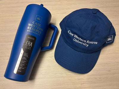 Photo of a CWRU Blue hat and Brumate