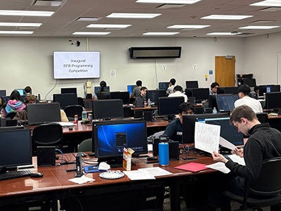 Students in a computer lab compete in the final round of the inaugural RFB Programming Competition