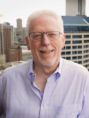 Grant Saviers photo with a city scape in the background