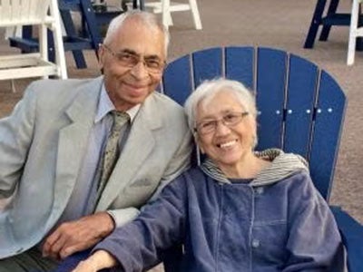 Shyam and Kalindi Pathak seated outside