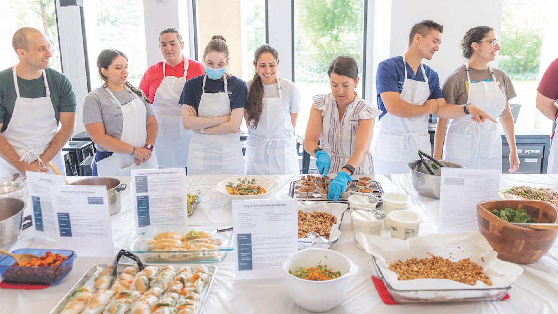 A group of students prepare a meal in the teaching kitchen