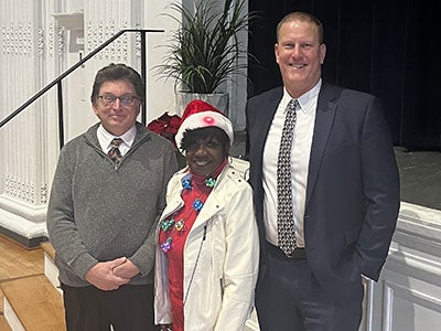 Fred Peck, Arlene Williams and Dean Tufts pose for a photo at the campus planning and facilities management holiday party