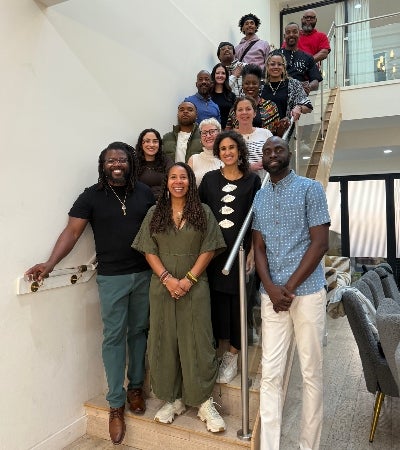 Group of people posing on stairs