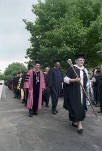 Commencement procession featuring president Agnar Pytte, congressman Louis Stokes, and university marshal Patricia Kilpatrick in 1991.