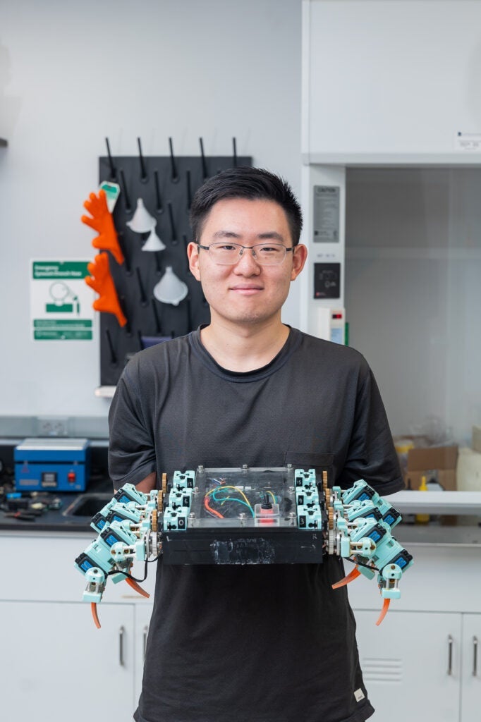 A member of Kati Daltorio’s lab showcases a robotic crab.