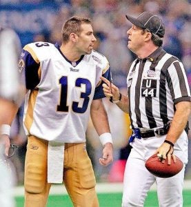 Jeff Rice officiating in NFL game, talking with player