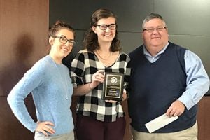 Amber Karel Gerace, Meghan Gibbons and Skip Begley posing for photo with an award