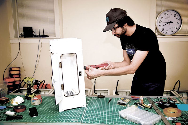 Case Western Reserve student Badar Kayani works on a prototype