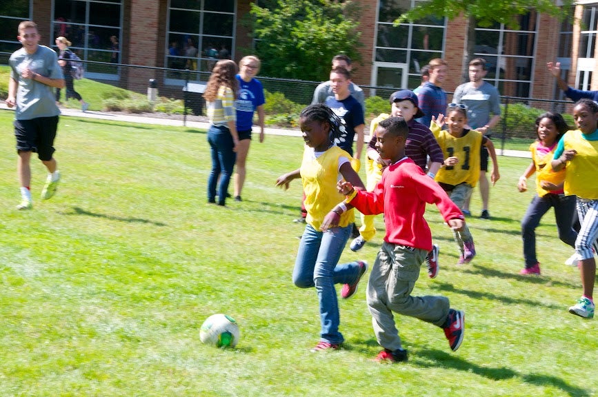 Young students playing soccer at CWRU