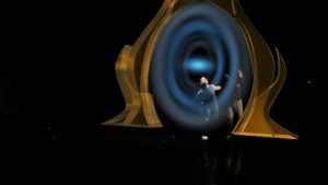 Still image from Imagined Odyssey with dancers near portal-like hologram