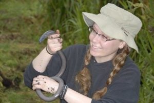Katherine Krynak holding an amphibian