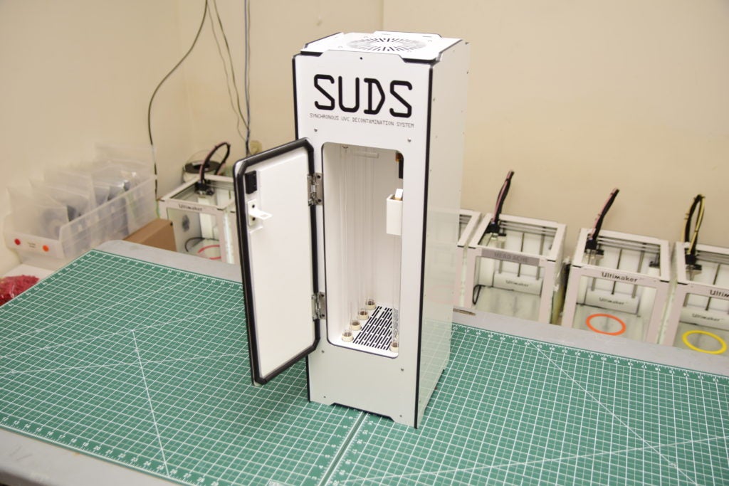 Photo of an N95 respirator disinfecting machine, called SUDS.