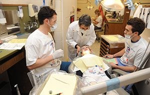 Dentists provide care to child
