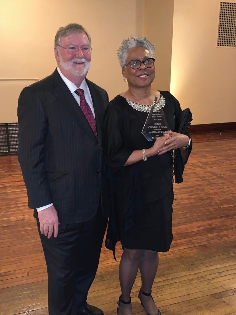 Photo of Grover C. Gilmore and Andrea Porter together with Porter holding the award