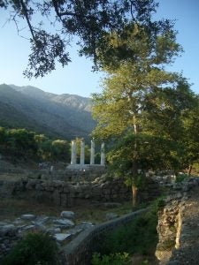 The Hieron, one of the major cult buildings in the central sanctuary, with Mount Phengari in the background.