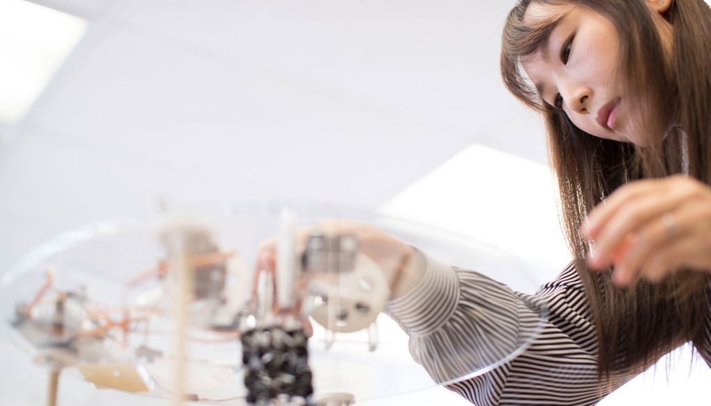 Photo of researcher Kiju Lee and her soft robot.