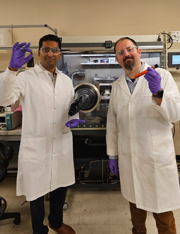Two researchers working in a lab