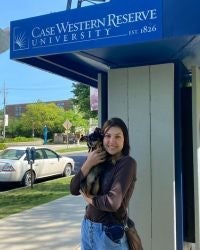 Photo of Mckenna Uzelac holding her pet.
