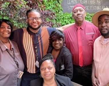 Photo of Members of the Custodial Services' supervisory team (Wilcox in red)