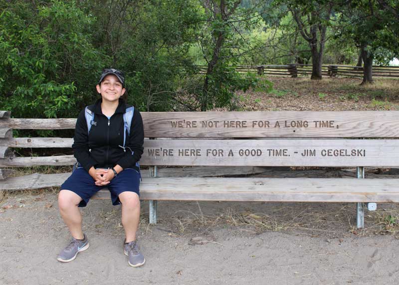 Case Western Reserve University student Monica Chavan sitting on a park bench