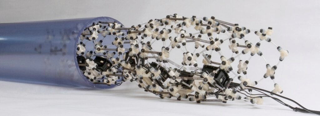 Photo of robotic sleeve for excavating underground power lines.