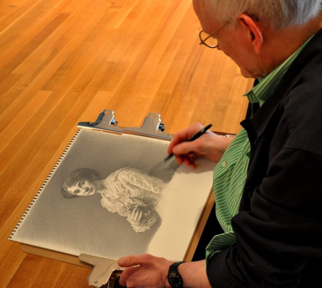 Photo of CWRU professor Ron Wilson drawing at the Cleveland Museum of Art