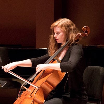 Photo of Sophie Benn playing the cello