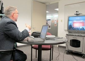 Victor Groza teleconferences with social workers in Romania