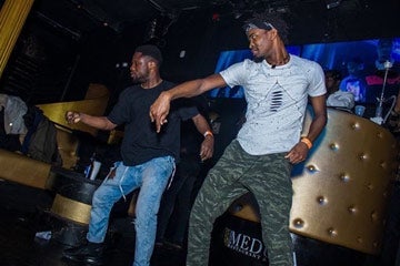 Photo of two men dancing