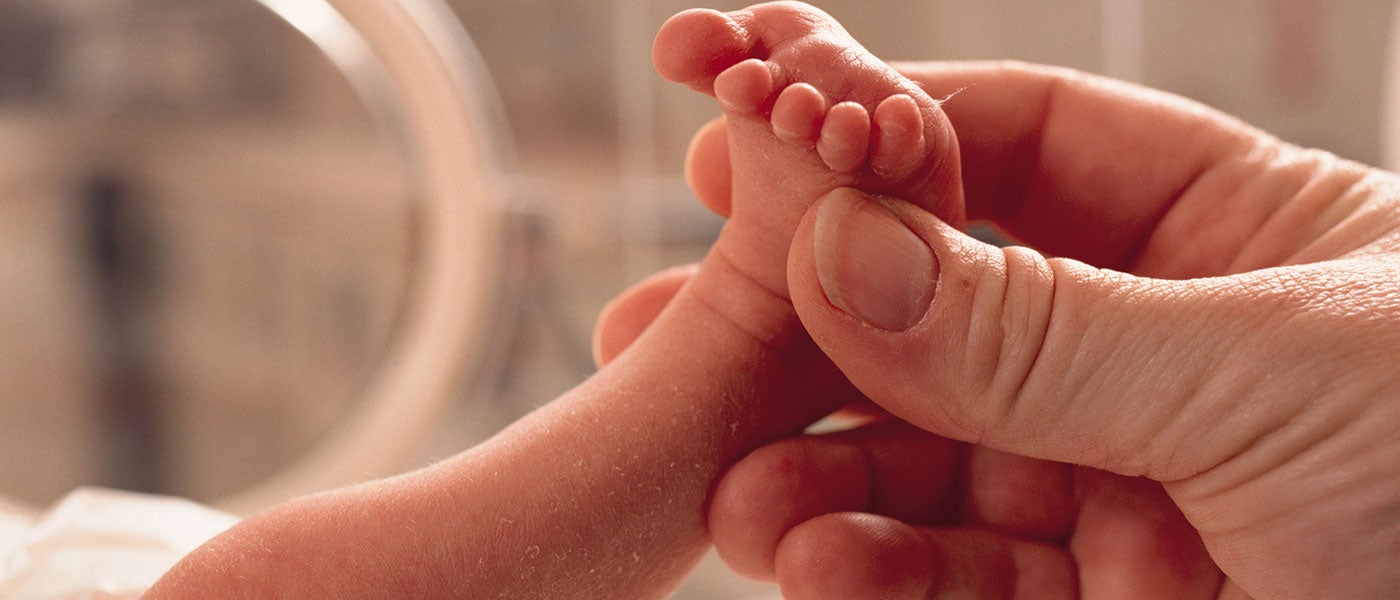 photo of baby looking left on white background