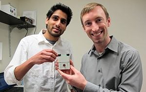 Punkaj Ahuja (left) and Patrick Leimkuehler (right) with a functional prototype blood test analyzer.