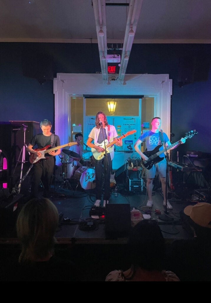 Photo of the EX/MAPLE band performing during Battle of the Bands