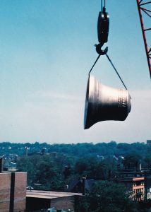 Largest bell of the McGaffin Carillon being hoisted over University Circle for installation in 1968