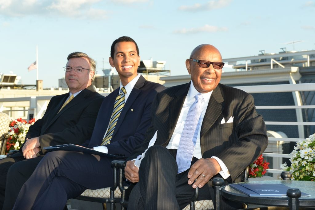 Anton Spencer (center) with Rep. Stokes at an event celebrating his scholarship award.