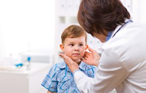 Doctor examining child